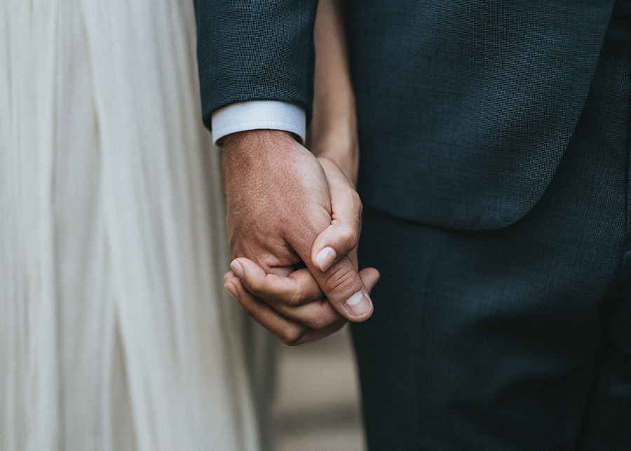 Magical Skies Wedding - close up of couple holding hands