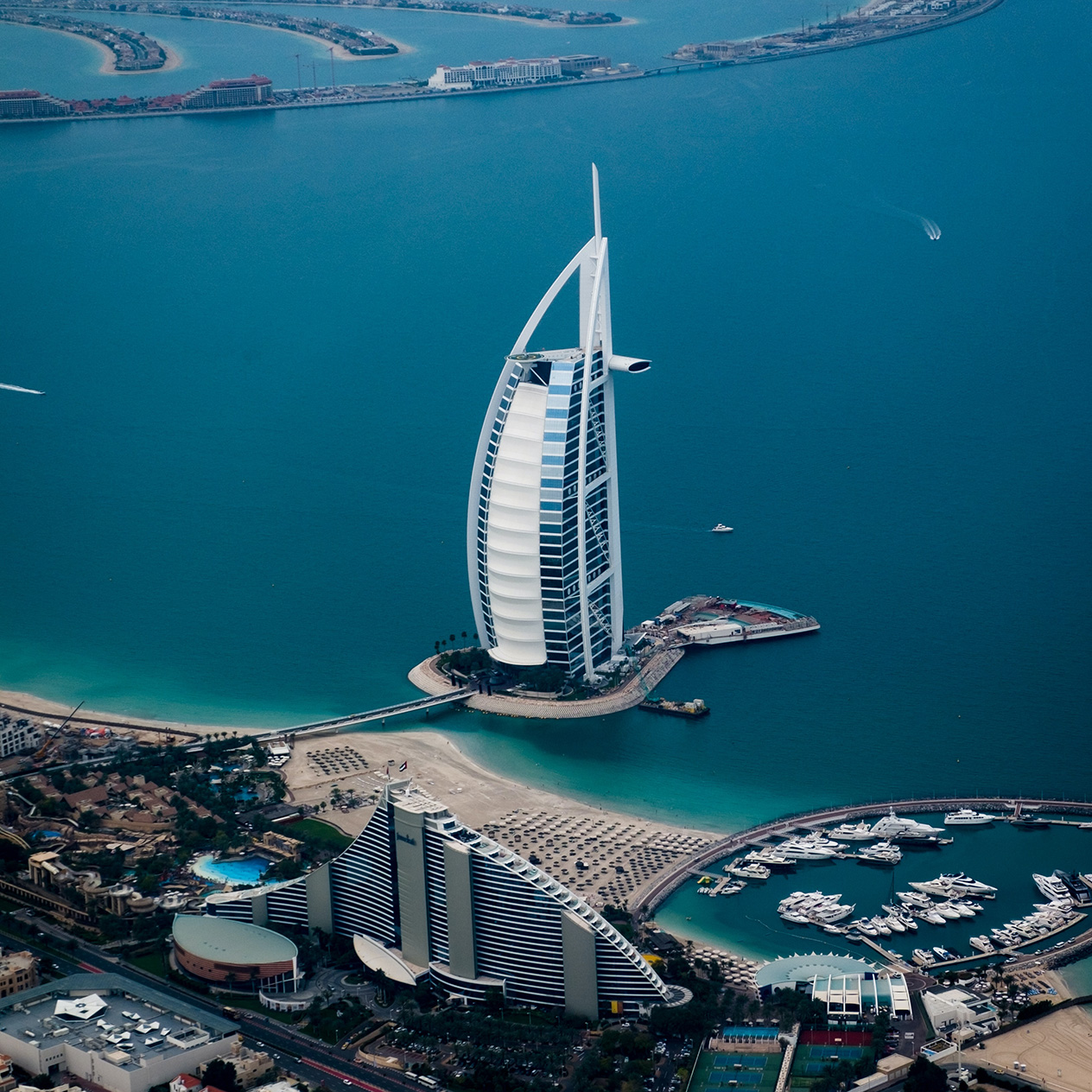 Photo of Burj Al Arab. The luxury hotel located a small distance from the mainland on a man made island.